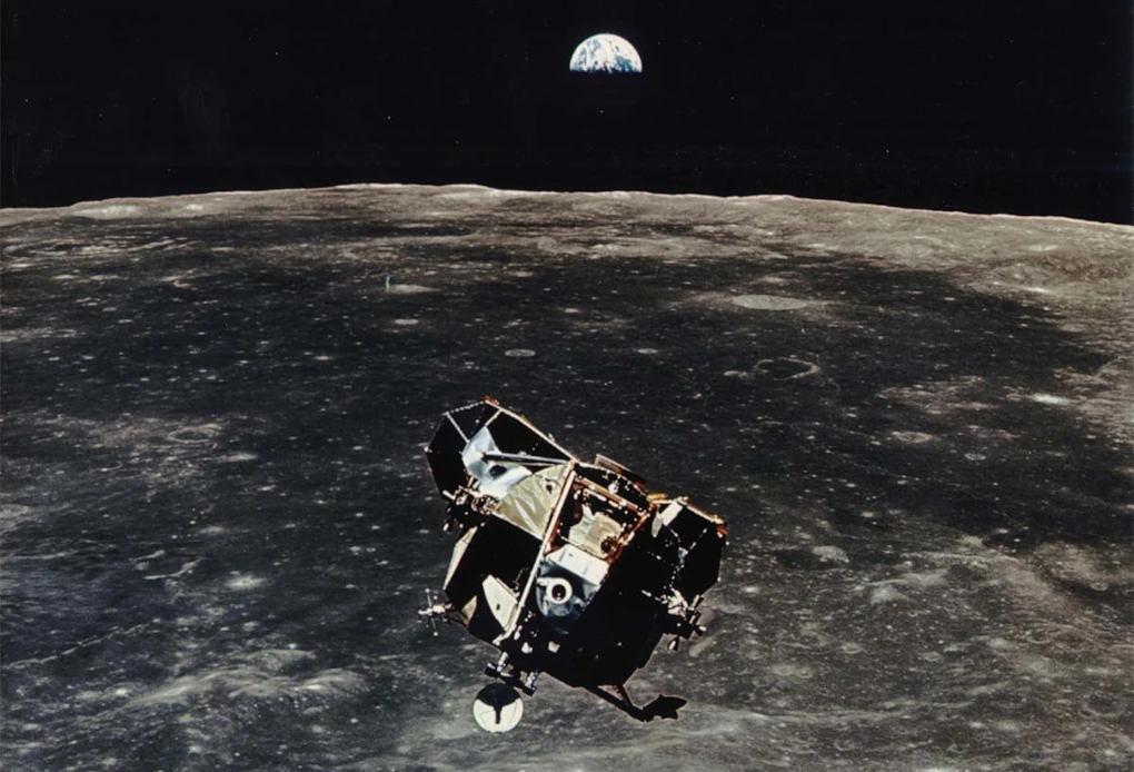 Photo of moon lander rising up from moon to return back to the main ship.