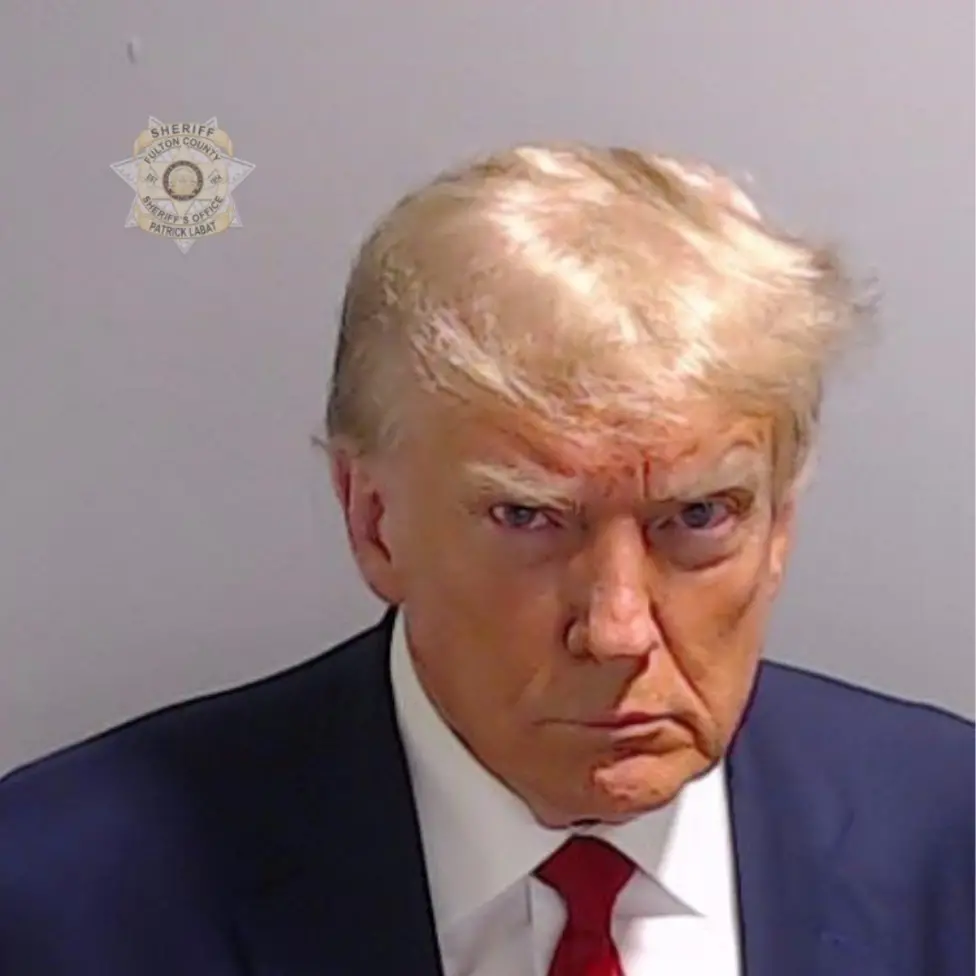 Photo shows Donald Trump's mugshot at the police station. He looks pissed off, tired and fed up of the slander and defamation he receives.