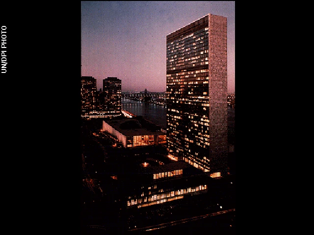 Photo shows the UN building at night.