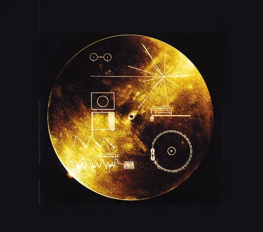 Photo showing how the golden record looks. There are markings and hierogliphs showing a map to where Earth is in the Universe.